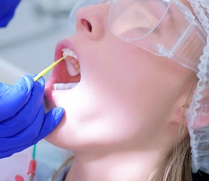 Patient receiving fluoride from a dentist in Hillsboro