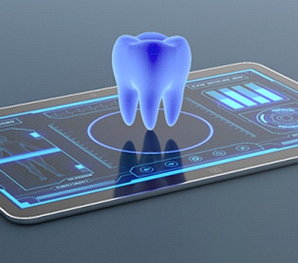 A tablet displaying a digital image of a tooth