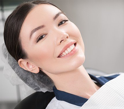 Woman with healthy smile in dental chair