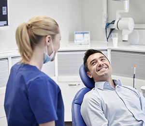 Male dental patient smiling before oral cancer screening