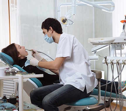 Woman at dentist for cleaning and checkup