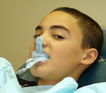 Young boy receiving fluoride treatment