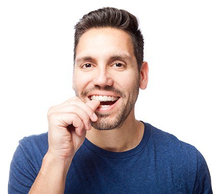 Man placing Invisalign tray