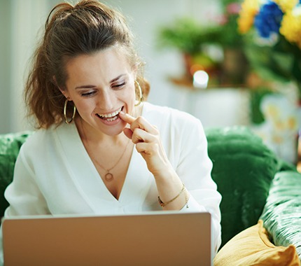 woman smiling about cost of cosmetic dentistry in Hillsboro