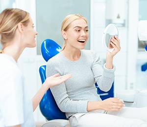 woman happy about cost of cosmetic dentistry in Hillsboro