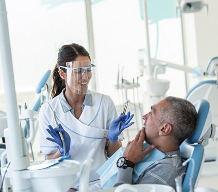 Hillsboro implant dentist discussing dental implants with patient