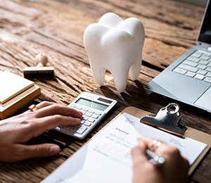 A dental insurance form on a wooden desk