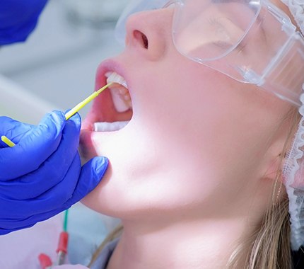 Patient receiving fluoride from a dentist in Hillsboro
