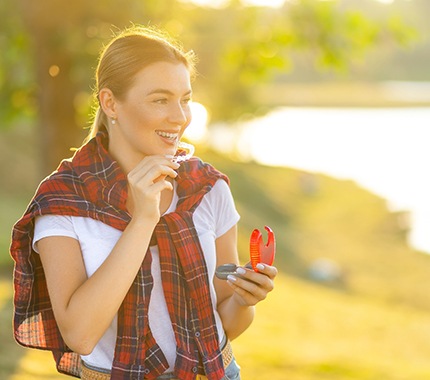 Woman walking outside with Invisalign in Hillsboro, OR