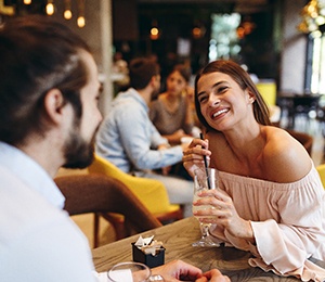Woman smiling on first date in restuarant