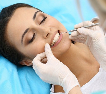 Woman receiving dental treatment