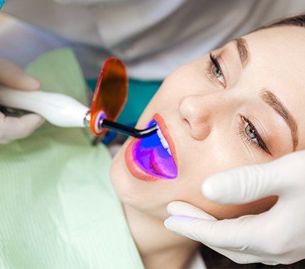Woman receiving dental sealants