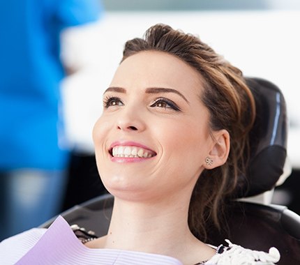 Woman smiling after a full mouth reconstruction 