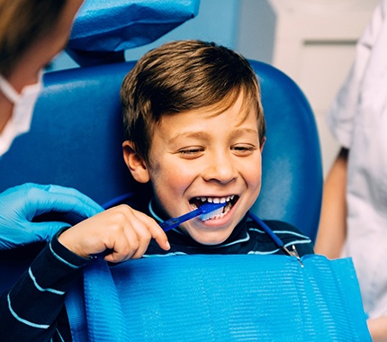 Child brushing his teeth
