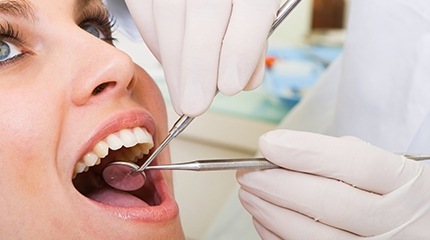 Woman receiving dental treatment