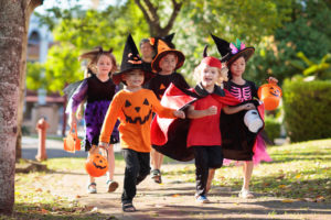 Happy children in Halloween costumes