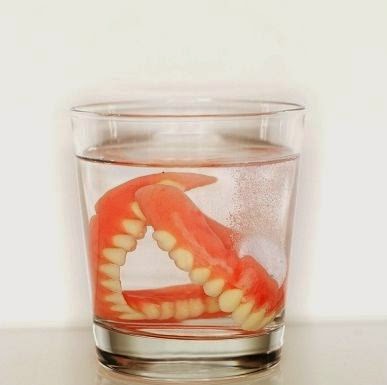dentures soaking in a glass overnight